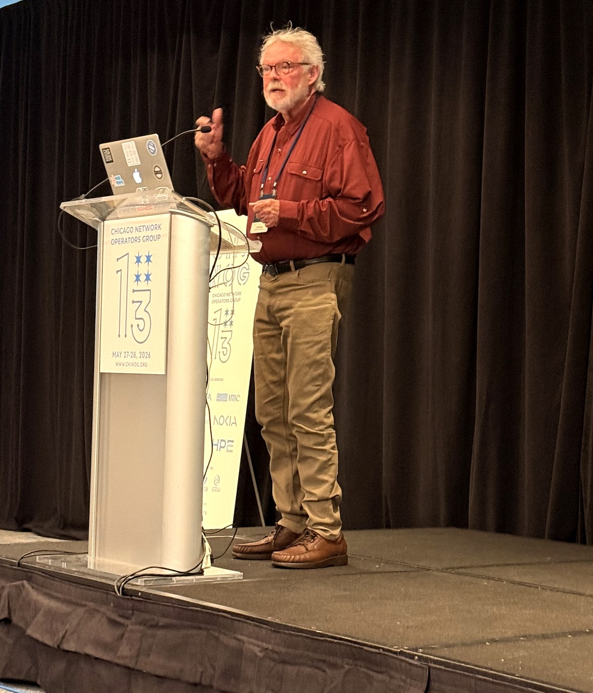Jeff Doyle delivering the NAF keynote from the CHI-NOG 13 podium